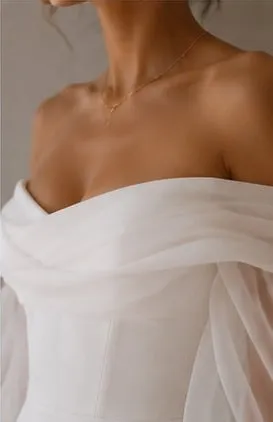 Close detail of the wedding satin on the Delphine wedding gown